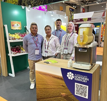 Staff at a display booth for Fruit Logistica event