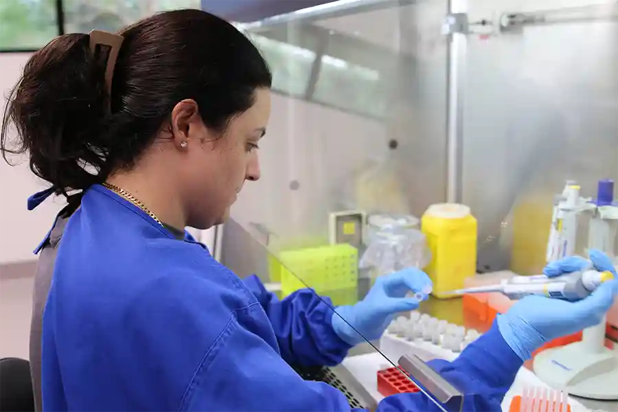 The Berrimah Veterinary Laboratory - Project Scientist Maria Mpilias conducting DNA extraction in the laboratory.